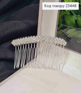 Гребень у волос, серебряного цвета, украшен ярко-блестящими камешками. 234148 фото